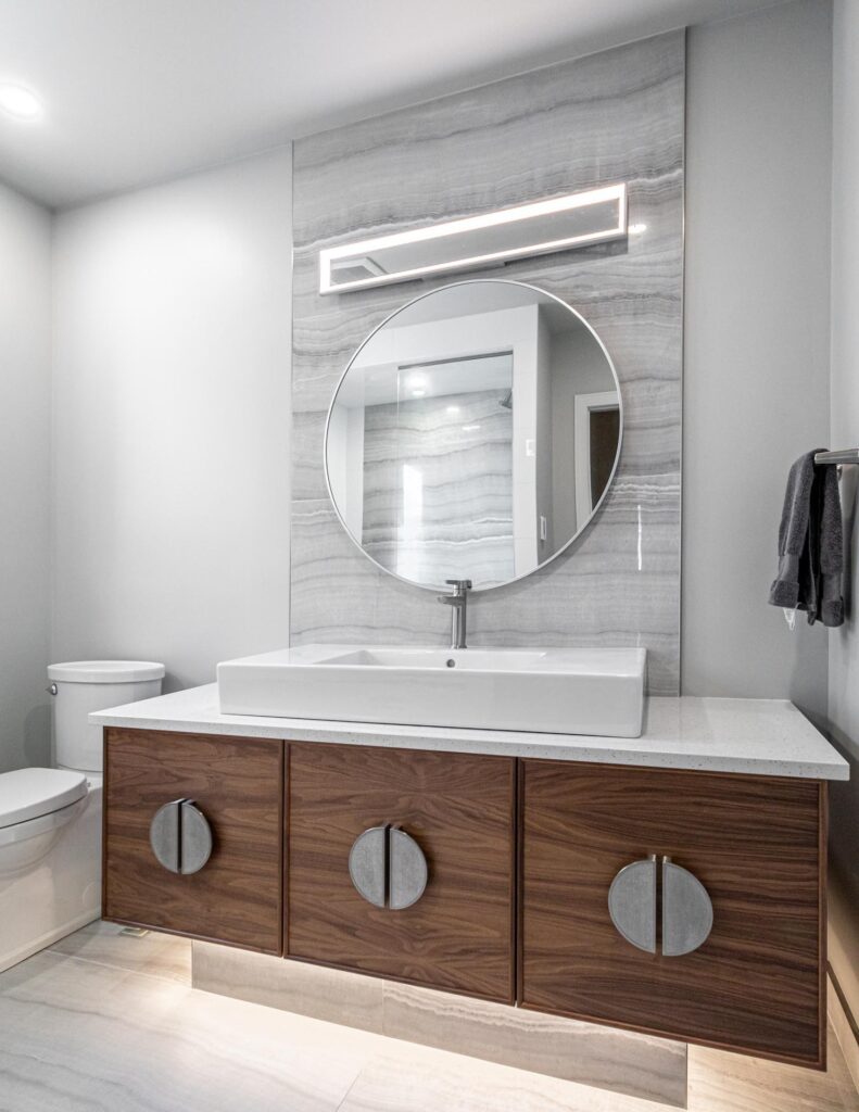 Lit mirror and vanity lighting in a bathroom by North Star Electric in Winnipeg, Manitoba