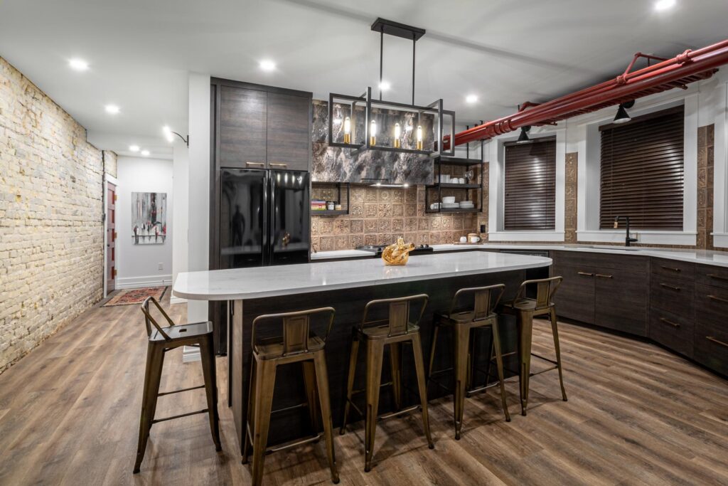 Pendant light fixtures over a kitchen island installed by North Star Electric in Winnipeg, Manitoba