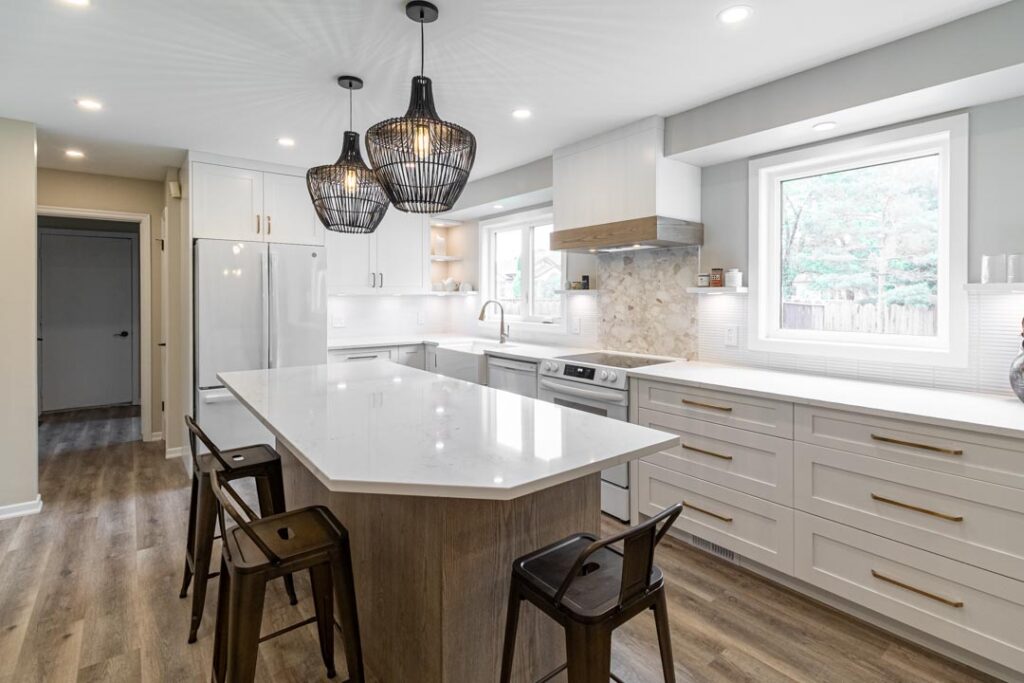 Pendant lights over a kitchen island by North Star Electric in Winnipeg, Manitoba