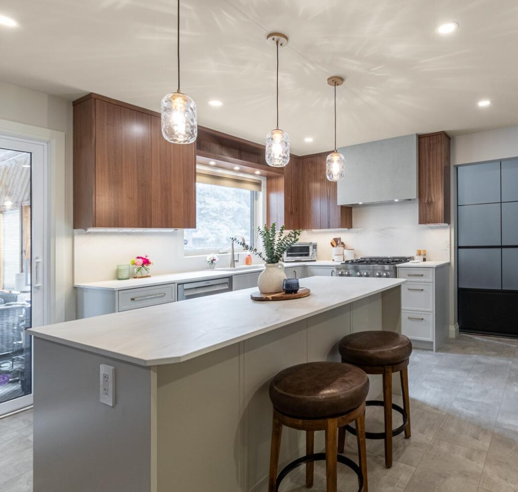 Pendant lighting over a kitchen island by North Star Electric in Winnipeg, Manitoba
