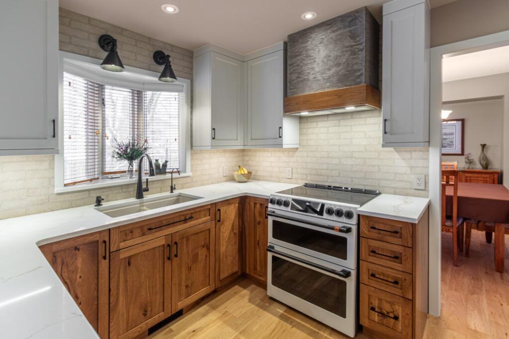 Recessed lighting in an open kitchen and living area by North Star Electric in Winnipeg, Manitoba